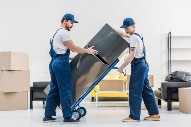man moving appliances